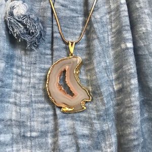 Moon shaped natural stone gold edging. Thin chain